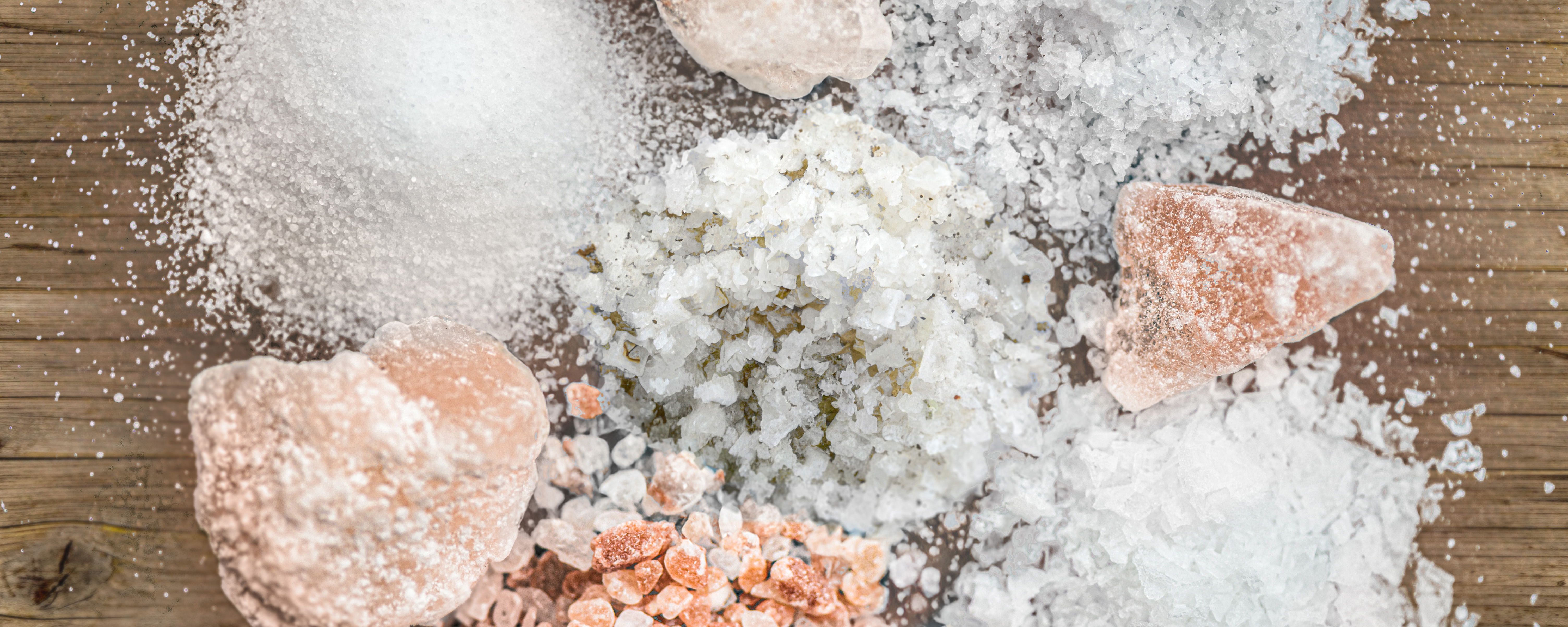 Different types of salt on a slate board